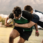 Image shows rugby tackle without shoulder injury